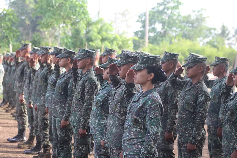 Marine salutes during formation, different angle